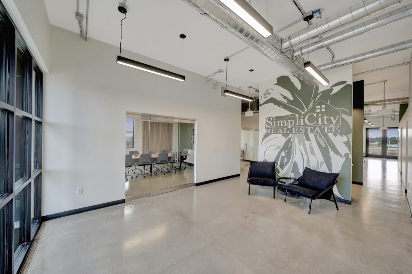 Green mural wall and seating inside the SimpliCity Real Estate office in Lincoln, Nebraska