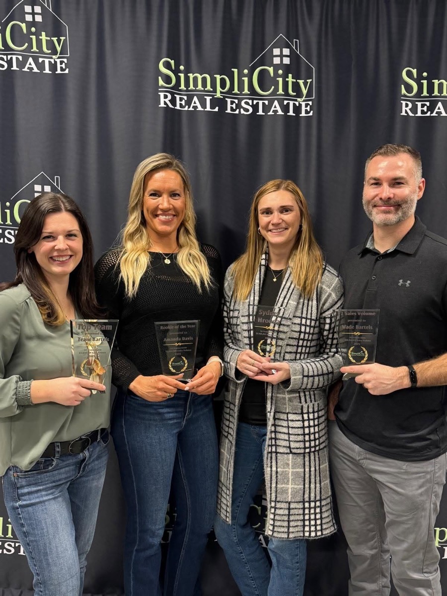 Sydney Hrouda with the SimpliCity Real Estate team on awards night