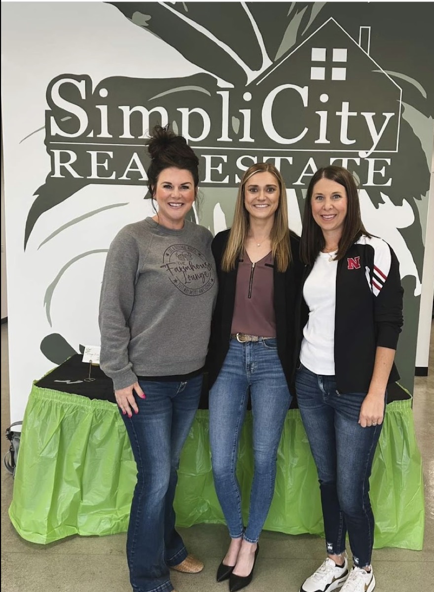 Sydney Hrouda at a SimpliCity Real Estate table at a community event in southeast Nebraska