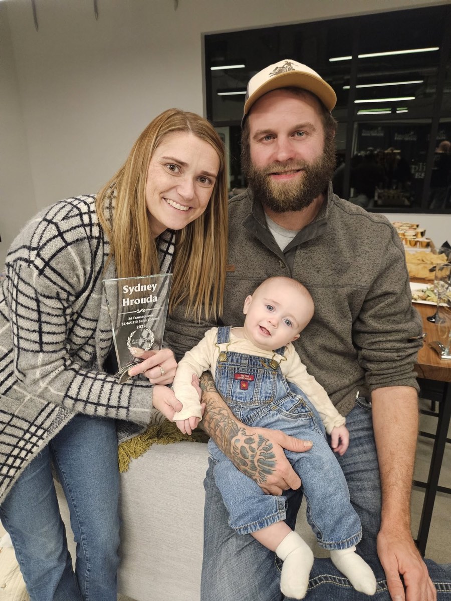 Sydney Hrouda with her husband and son at a SimpliCity Real Estate event